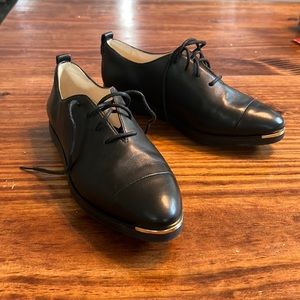 Black Cole Haan leather oxford sneakers
